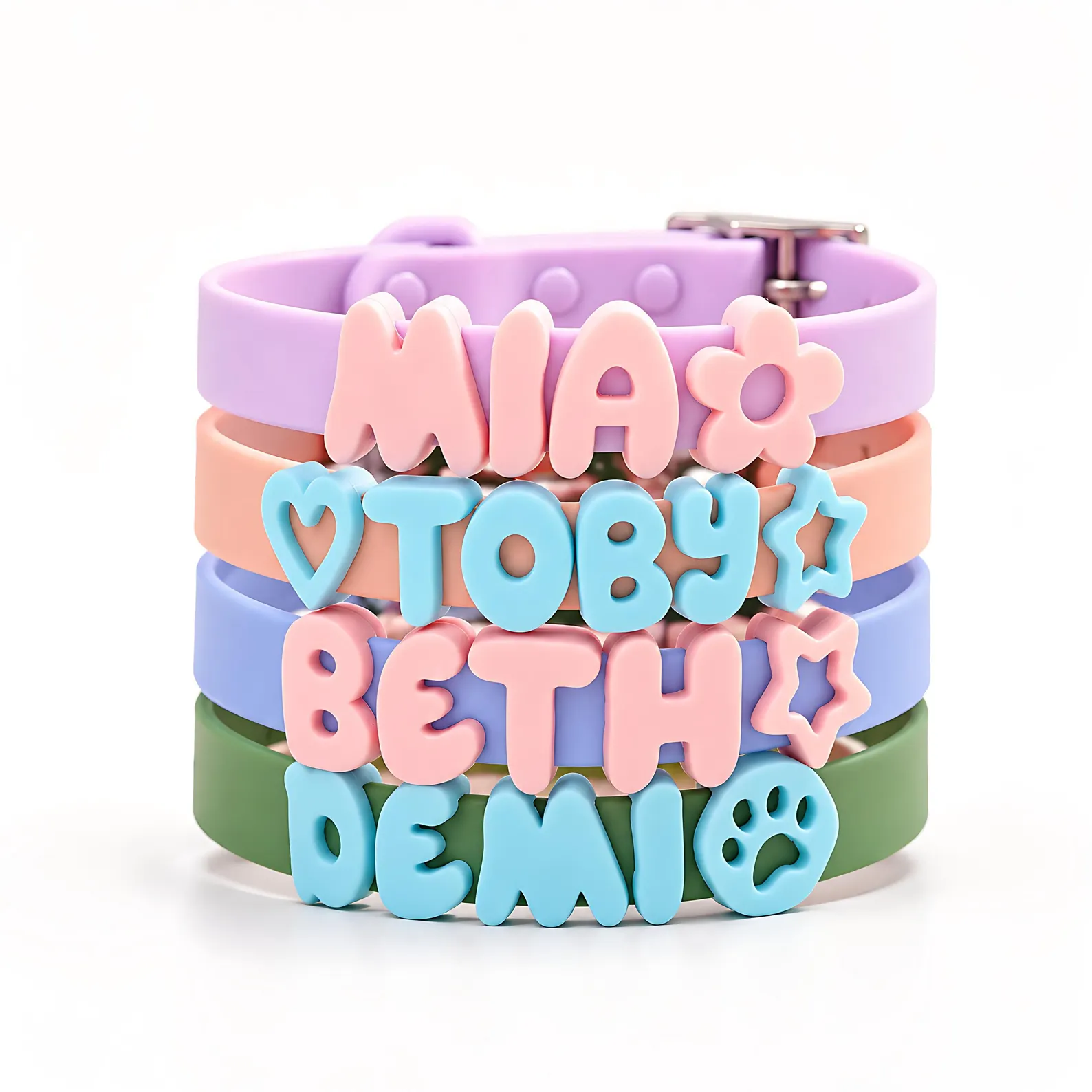 Stack of personalized Pupora collars with charms
